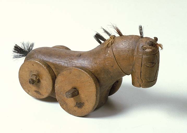 jouet (cheval à roulettes)
