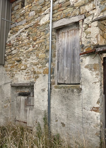 Porte fenière suspendue, ferme au Collet.