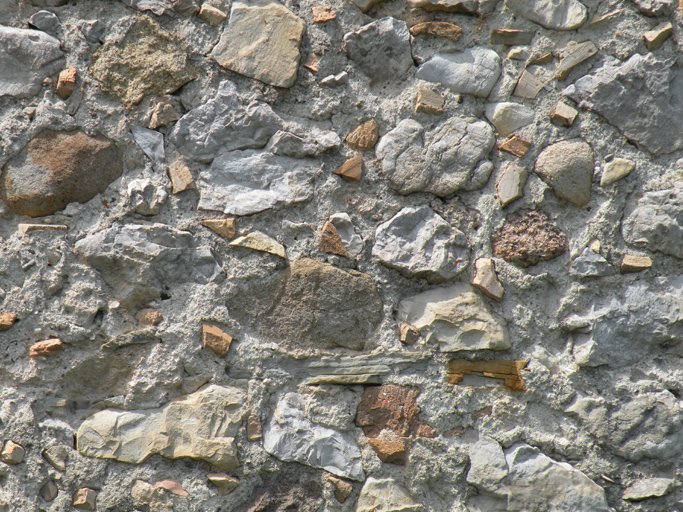 Le Coulet. Détail d'un enduit à inclusions.